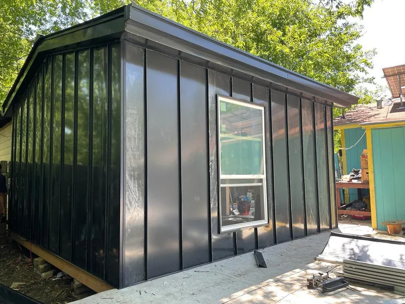 Black standing seam metal wall panels for Roof Inspection in George Mason